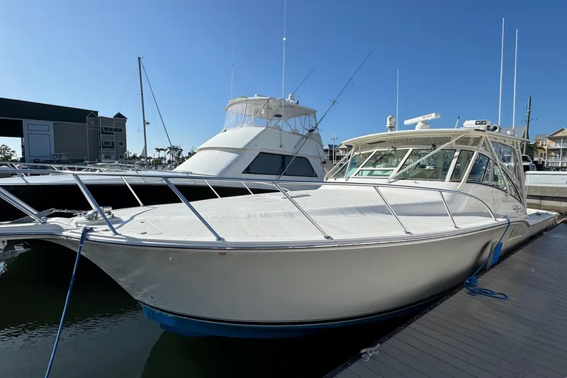 The Image of 2007 Albemarle 410 Express Fisherman docked at marina under clear blue sky. - 0