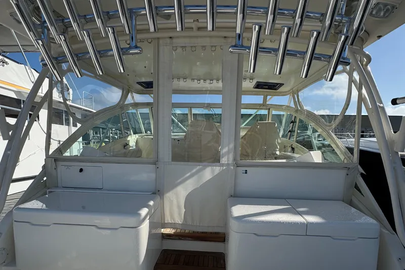 Slide: The Image of 2007 Albemarle 410 Express Fisherman boat interior with rod holders and seating. - 10
