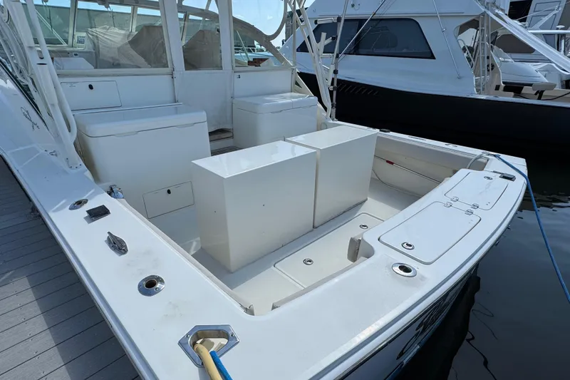 Slide: The Image of 2007 Albemarle 410 Express Fisherman boat deck with seating and storage compartments. - 12