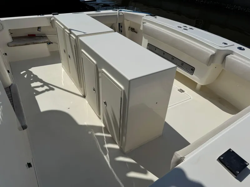 Slide: The Image of 2007 Albemarle 410 Express Fisherman boat deck with storage compartments and seating. - 14