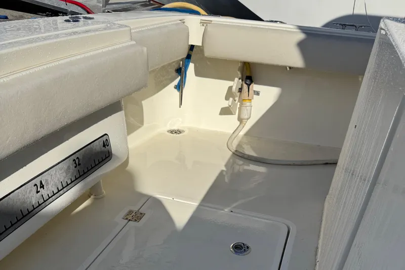 Slide: The Image of 2007 Albemarle 410 Express Fisherman boat deck with measuring scale and hose. - 18