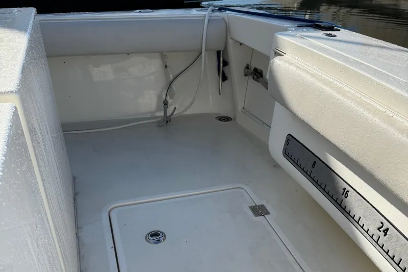 Slide: The Image of 2007 Albemarle 410 Express Fisherman boat deck with measuring ruler and storage hatch. - 19