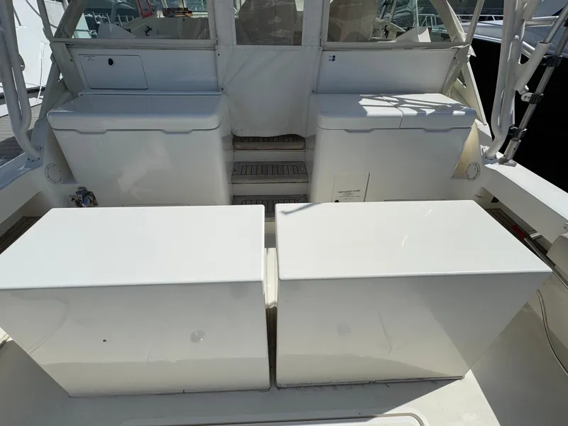 Slide: The Image of 2007 Albemarle 410 Express Fisherman boat deck with storage compartments. - 23