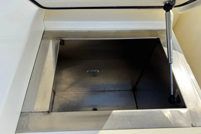 Slide: The Image of Open storage compartment on a 2007 Albemarle 410 Express Fisherman boat. - 27
