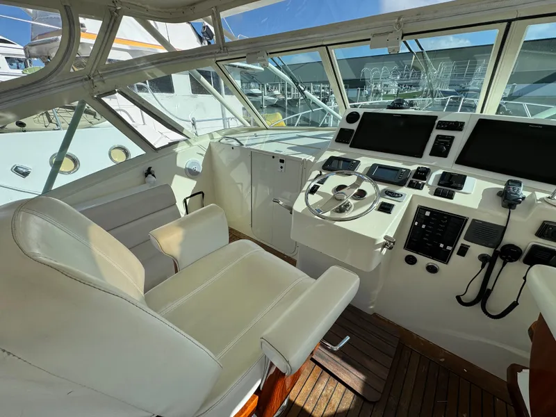 Slide: The Image of 2007 Albemarle 410 Express Fisherman helm with modern controls and comfortable seating. - 31
