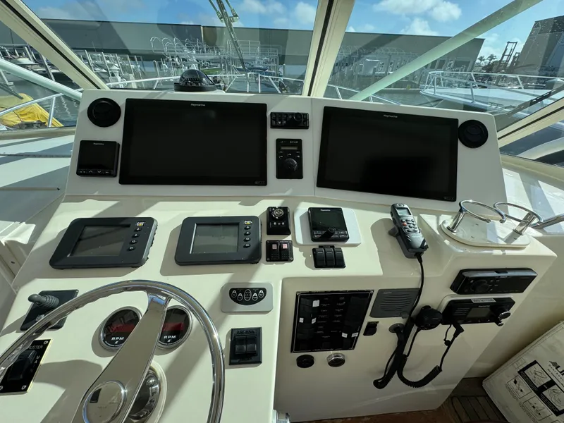 Slide: The Image of Control panel of 2007 Albemarle 410 Express Fisherman with navigation screens and steering wheel. - 33