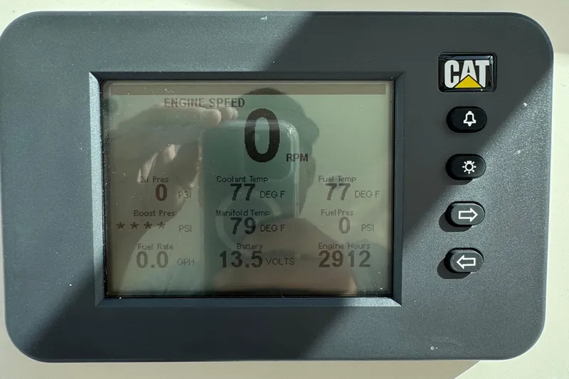 Slide: The Image of Display panel of a 2007 Albemarle 410 Express Fisherman showing engine metrics. - 37