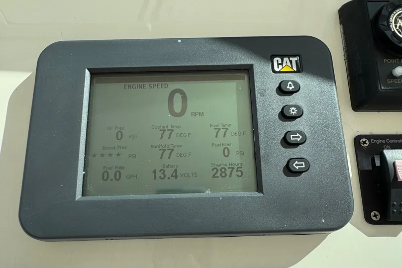 Slide: The Image of CAT engine display showing 0 RPM and 2875 engine hours on a 2007 Albemarle 410 Express Fisherman. - 38