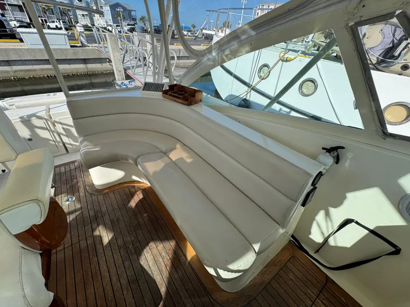 Slide: The Image of 2007 Albemarle 410 Express Fisherman boat interior with white seating and wooden deck. - 41