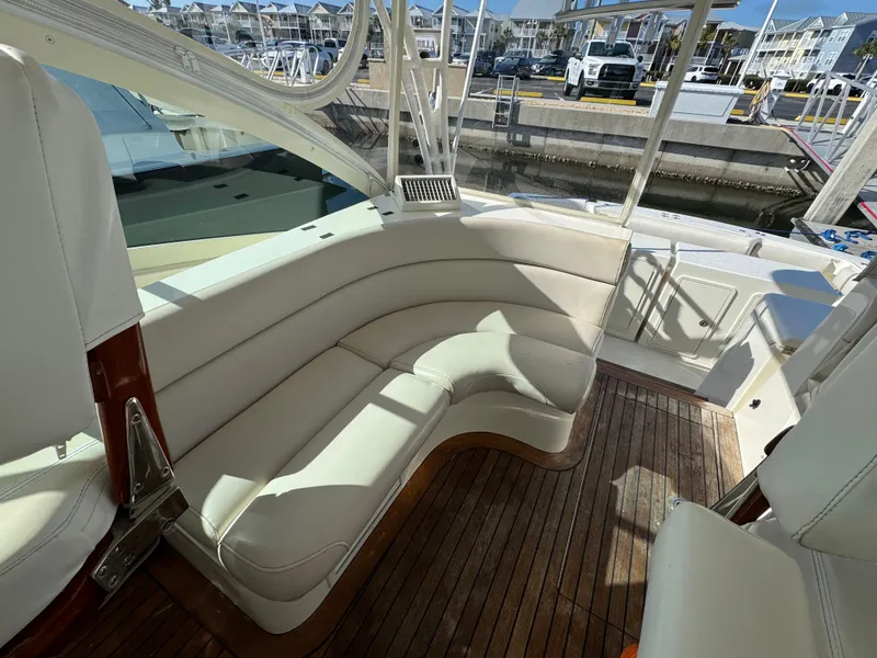 Slide: The Image of 2007 Albemarle 410 Express Fisherman boat with white seating and wooden deck. - 42
