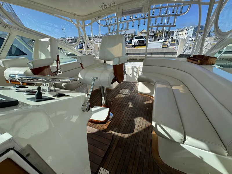 Slide: The Image of 2007 Albemarle 410 Express Fisherman interior with white seating and wooden flooring. - 43