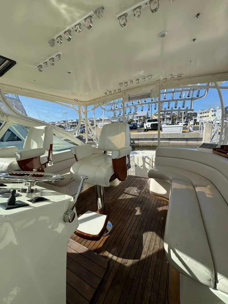 Slide: The Image of 2007 Albemarle 410 Express Fisherman yacht interior with seating and controls. - 44