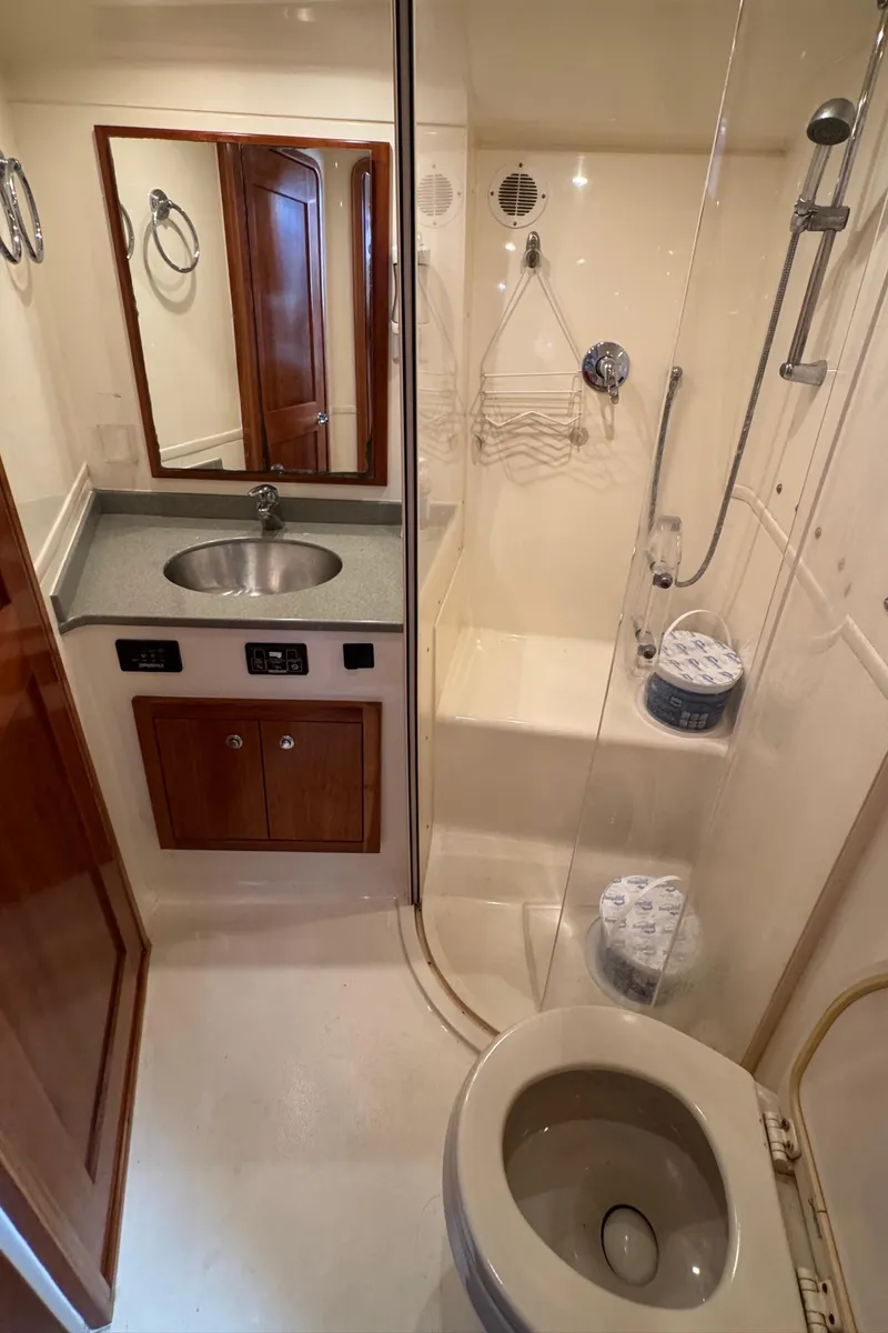 Slide: The Image of 2007 Albemarle 410 Express Fisherman bathroom with shower, sink, and toilet. - 53