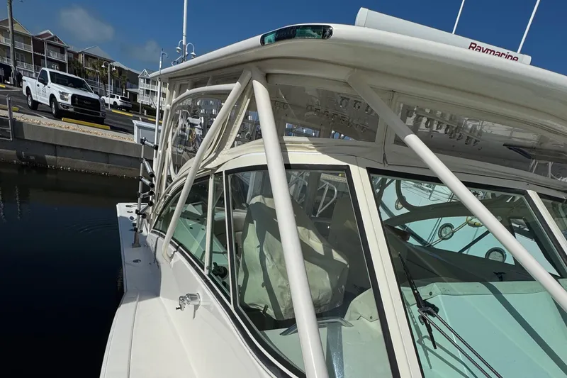 Slide: The Image of 2007 Albemarle 410 Express Fisherman docked, showcasing sleek design and sturdy structure. - 6