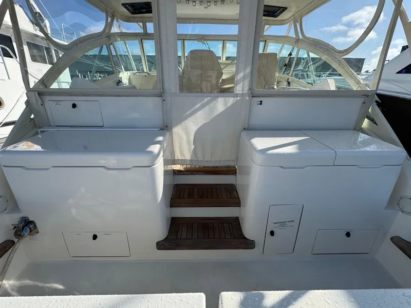 Slide: The Image of 2007 Albemarle 410 Express Fisherman boat interior with seating and storage compartments. - 24