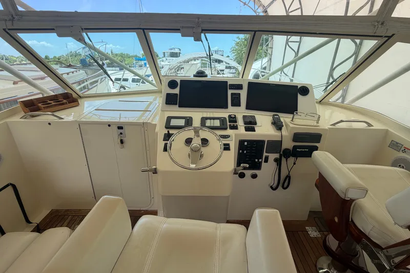 Slide: The Image of Helm of 2007 Albemarle 41 Express boat with steering wheel and navigation equipment. - 31