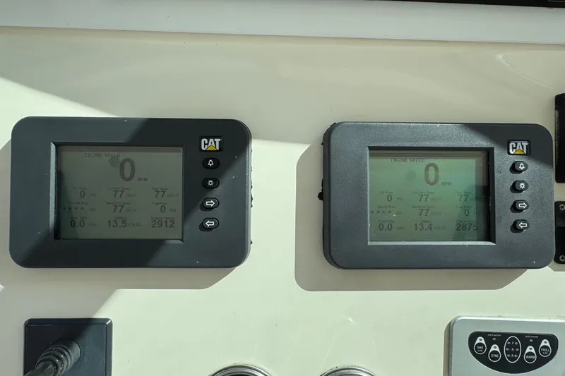 Slide: The Image of Digital displays on a 2007 Albemarle 410 Express Fisherman boat dashboard. - 36