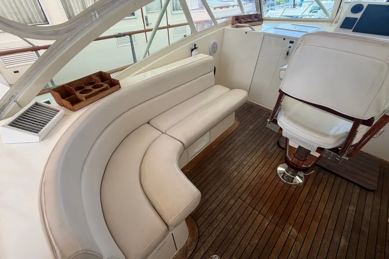 Slide: The Image of Luxurious interior of 2007 Albemarle 41 Express yacht with plush seating and wooden flooring. - 29