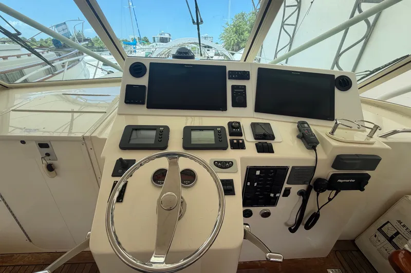 Slide: The Image of Helm of 2007 Albemarle 41 Express boat with navigation equipment and steering wheel. - 32