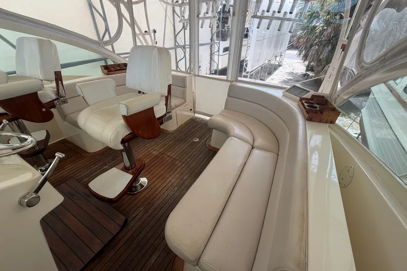 Slide: The Image of Interior of 2007 Albemarle 41 Express yacht with white seating and wooden flooring. - 28
