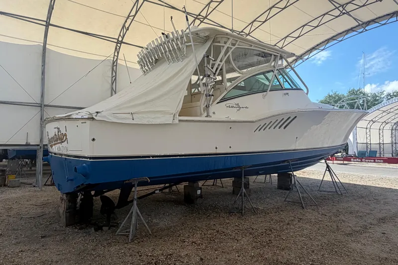 Slide: The Image of 2007 Albemarle 41 Express boat in storage, covered and elevated on stands. - 81
