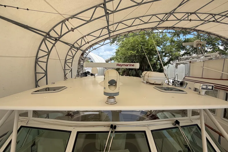 Slide: The Image of 2007 Albemarle 41 Express boat under canopy with Raymarine equipment visible. - 22