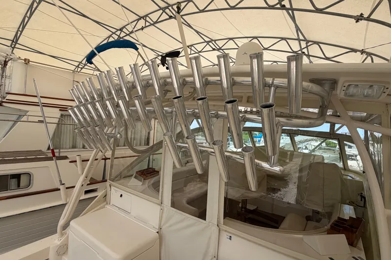 Slide: The Image of 2007 Albemarle 41 Express boat with multiple rod holders under a canopy. - 15