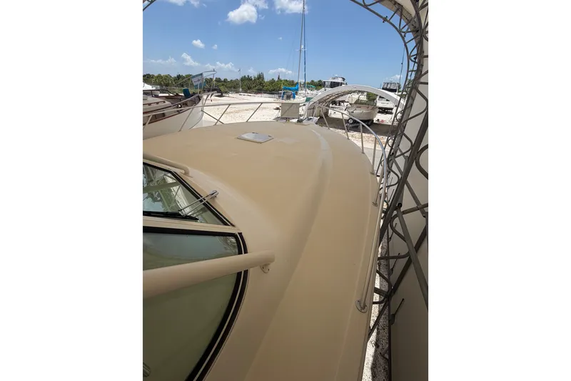 Slide: The Image of 2007 Albemarle 41 Express boat deck under a clear blue sky. - 21