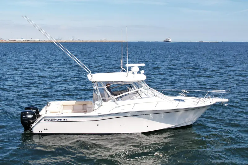 Slide: The Image of 2007 Grady-White Express 330 boat on open water, side view. - 1