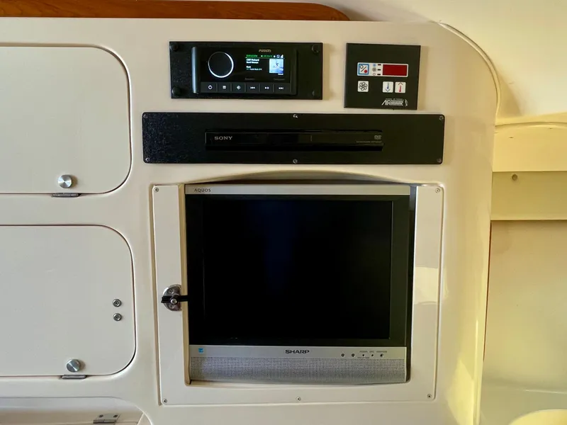 Slide: The Image of 2007 Grady-White Express 330 interior with Sony audio system and Sharp TV. - 13