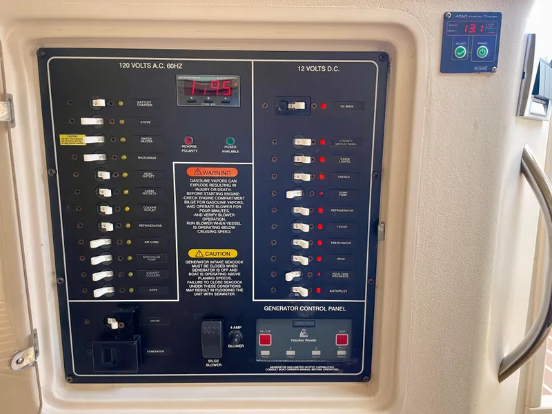 Slide: The Image of Electrical control panel on a 2007 Grady-White Express 330 boat. - 22