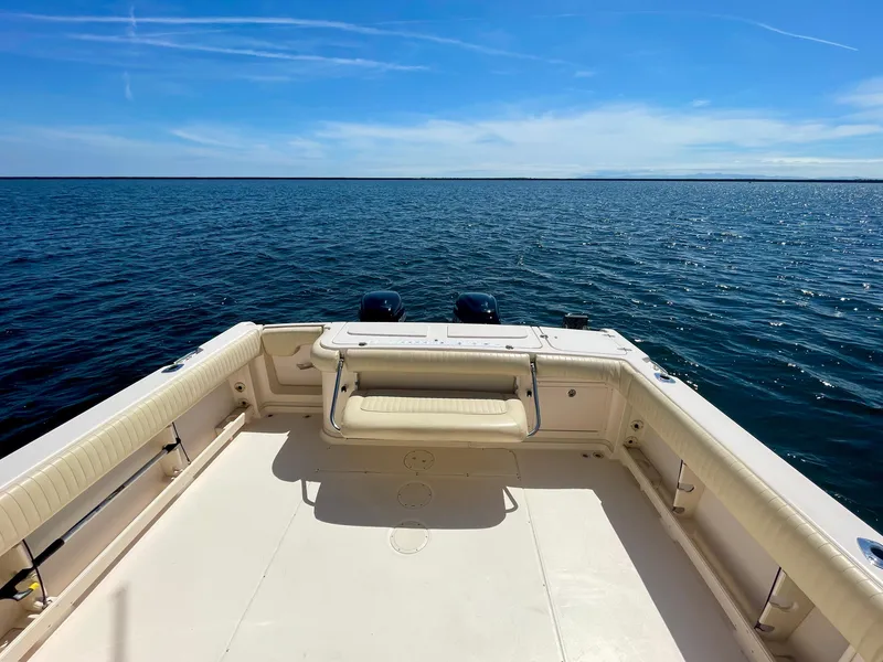 Slide: The Image of 2007 Grady-White Express 330 boat deck overlooking calm ocean waters. - 24