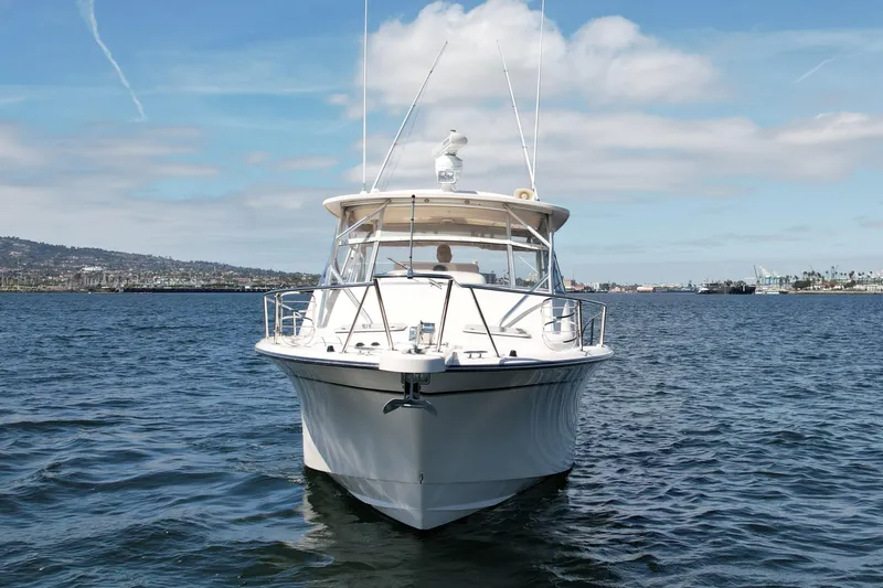 Slide: The Image of 2007 Grady-White Express 330 boat on open water under a blue sky. - 3
