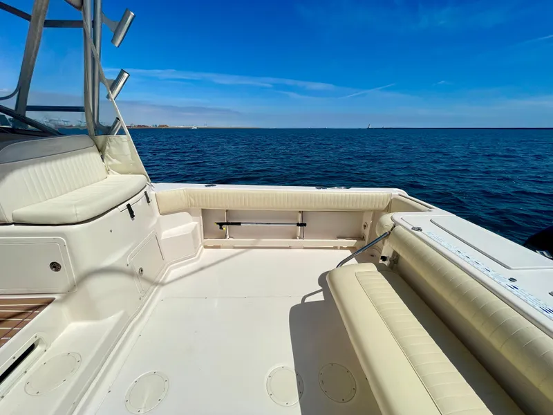 Slide: The Image of 2007 Grady-White Express 330 boat deck with ocean view under clear blue sky. - 30