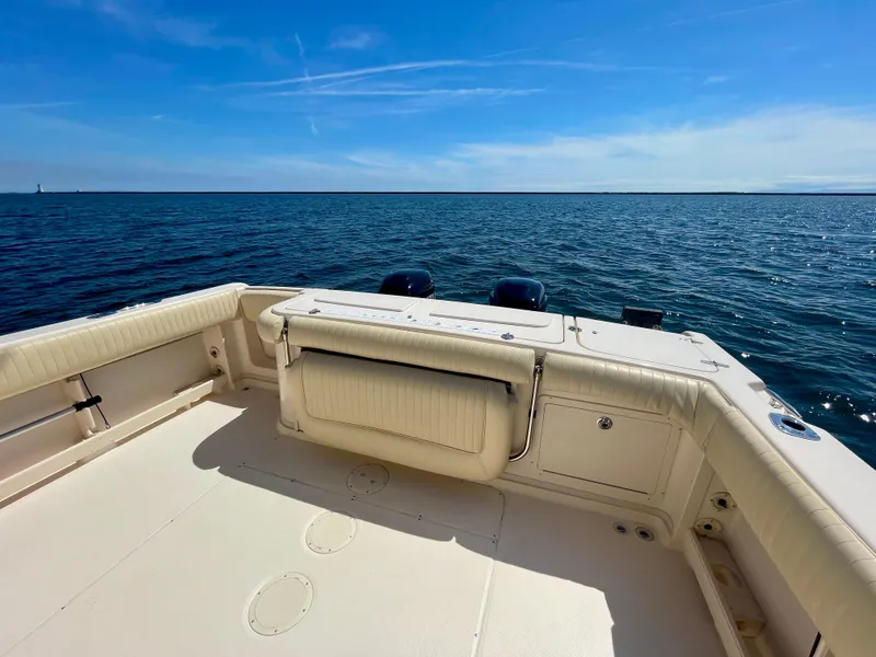 Slide: The Image of 2007 Grady-White Express 330 boat deck with ocean view under clear blue sky. - 31