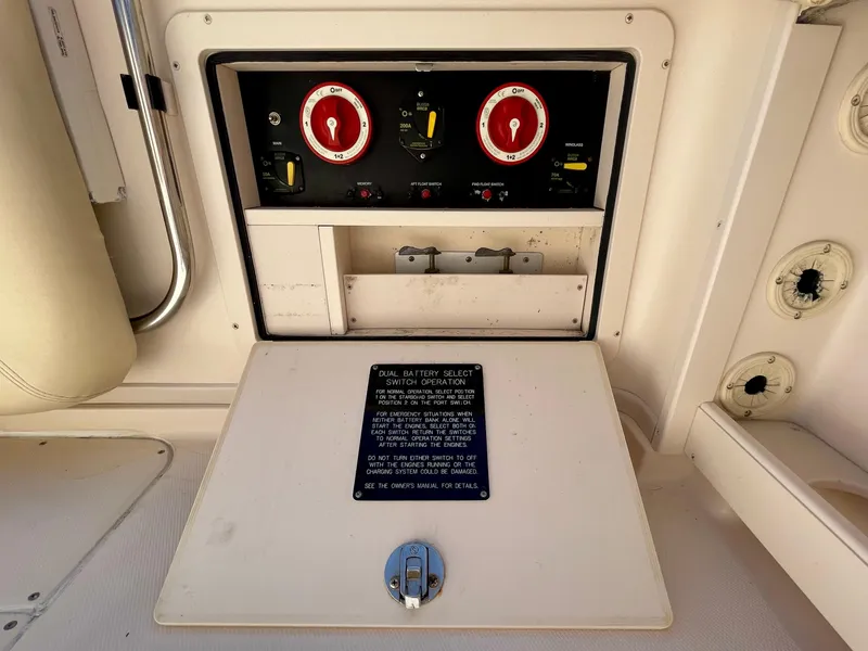 Slide: The Image of 2007 Grady-White Express 330 control panel with gauges and switches. - 32