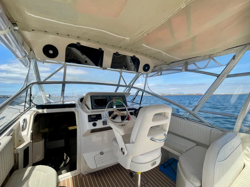 Slide: The Image of 2007 Grady-White Express 330 boat interior with helm, seating, and ocean view. - 34