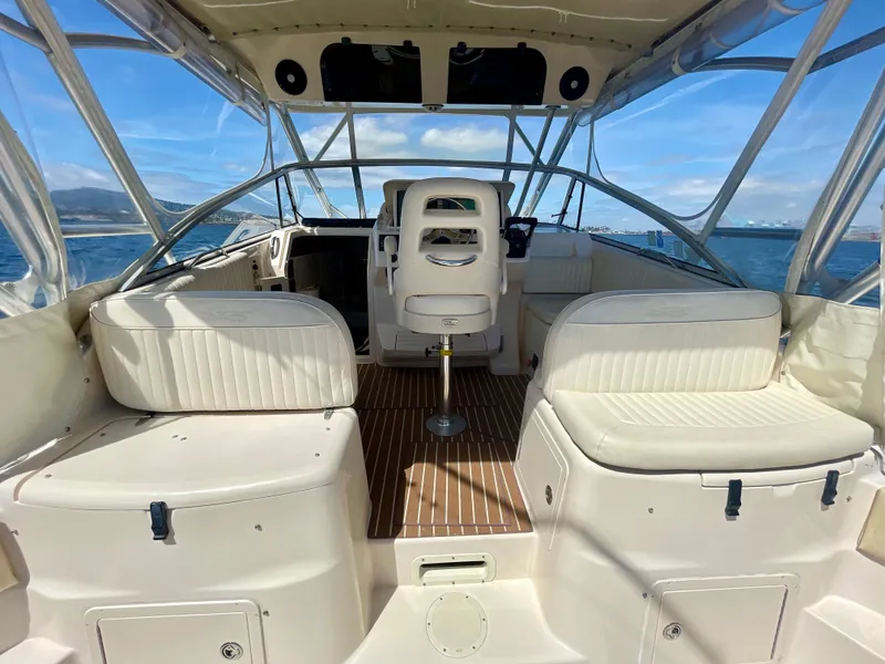 Slide: The Image of 2007 Grady-White Express 330 boat interior with seating and helm, on open water. - 35