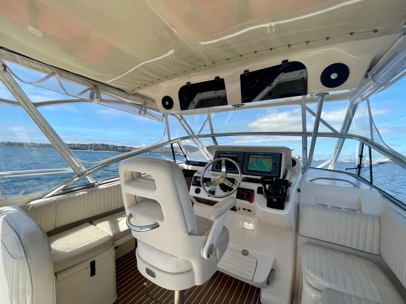 Slide: The Image of 2007 Grady-White Express 330 boat interior with helm, seating, and ocean view. - 36