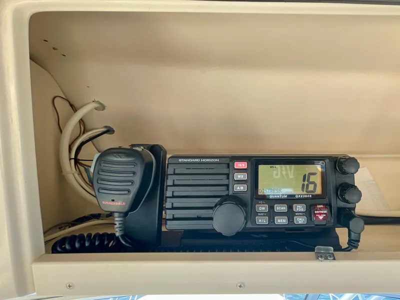 Slide: The Image of Marine radio system on a 2007 Grady-White Express 330 boat dashboard. - 39