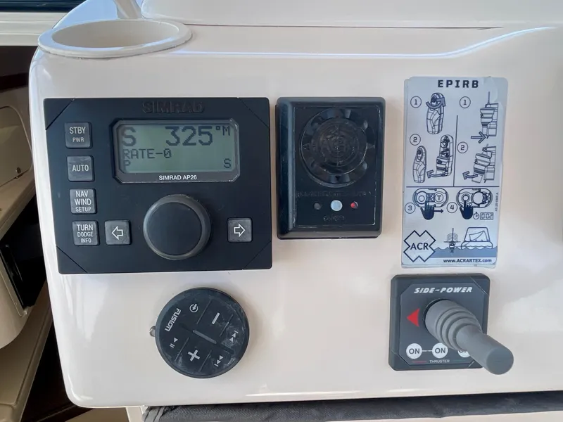 Slide: The Image of Control panel of a 2007 Grady-White Express 330 boat with navigation and EPIRB instructions. - 42