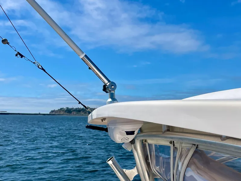Slide: The Image of 2007 Grady-White Express 330 boat with fishing rod, ocean view, and clear blue sky. - 47