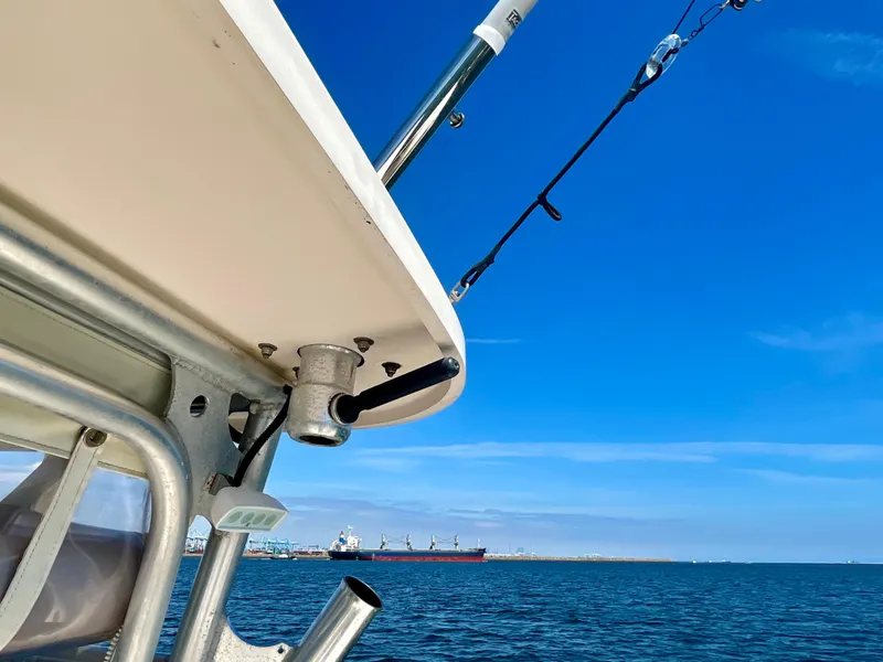 Slide: The Image of 2007 Grady-White Express 330 boat on open water with clear blue sky. - 48