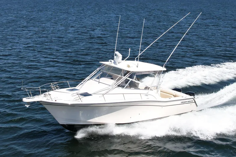 Slide: The Image of 2007 Grady-White Express 330 boat cruising on open water. - 7