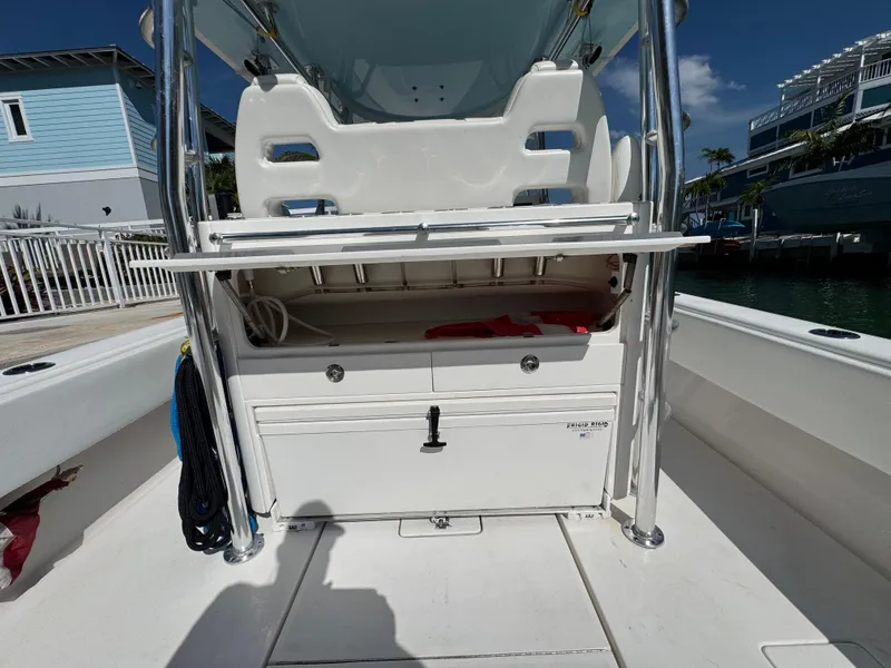Slide: The Image of 2021 Contender 39 Fisharound boat interior with storage compartment and seating. - 24