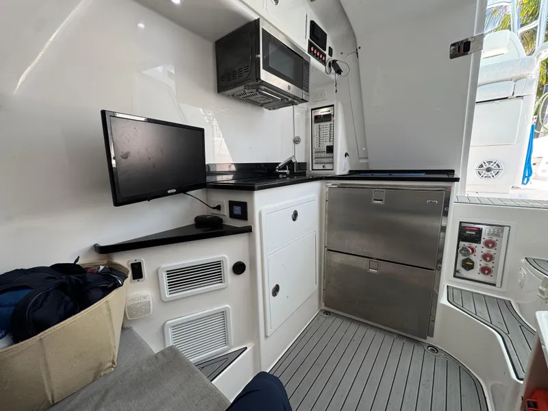 Slide: The Image of 2021 Contender 39 Fisharound interior with modern kitchen appliances and sleek design. - 30