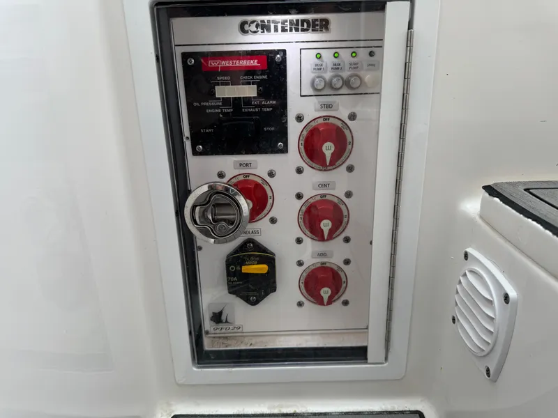 Slide: The Image of Control panel of 2021 Contender 39 Fisharound boat with switches and indicators. - 33