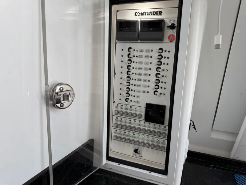 Slide: The Image of Electrical panel of 2021 Contender 39 Fisharound boat, featuring control switches and indicators. - 34
