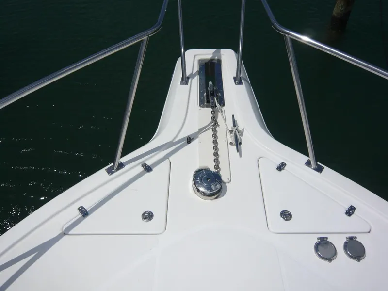 Slide: The Image of Bow of 2004 Rampage 38 Express boat with anchor chain and railing. - 18