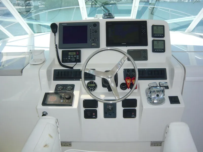 Slide: The Image of Control panel of 2004 Rampage 38 Express boat with navigation and communication equipment. - 22